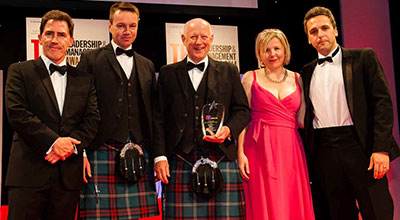 Communications and Marketing staff with award for Outstanding Marketing/Communications Team