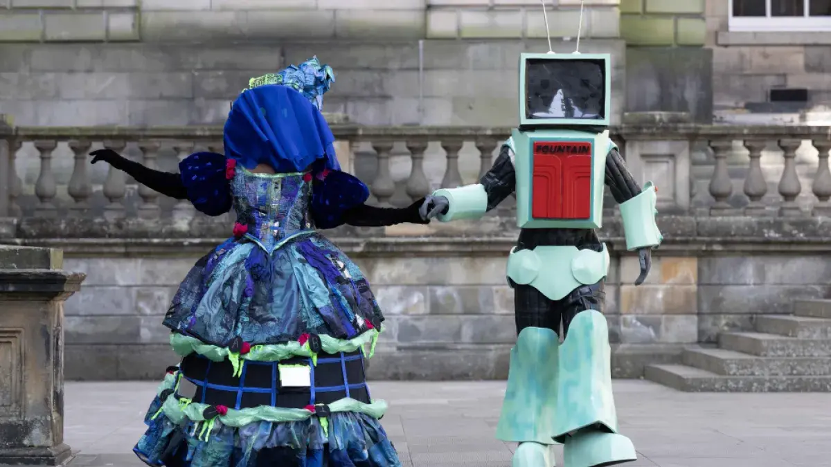 Two students pose in costumes created for the 2025 Performance Costume Show. (L-R) The Winchester Ghoul and Ad-bot