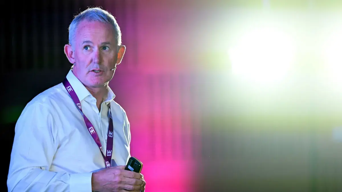 A speaker on stage at the EIE25 tech conference