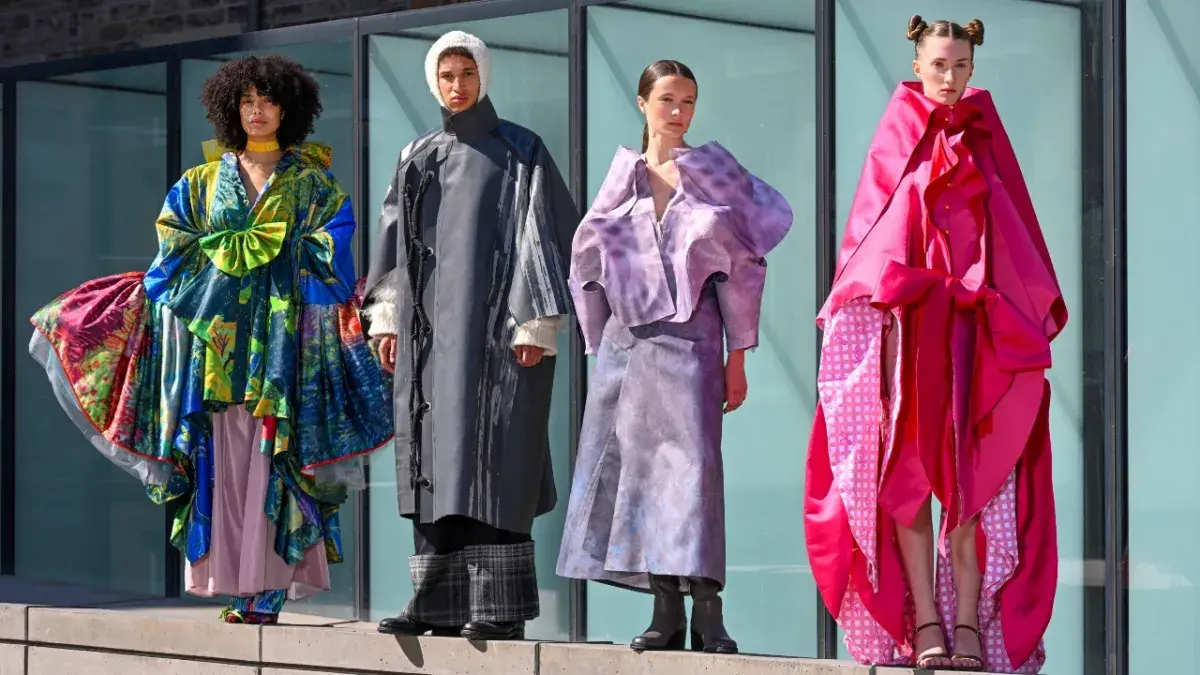 A group of young people model designs by final year students taking part in the Edinburgh College of Art Fashion Show 2025.