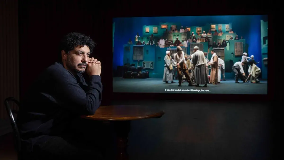 Artist Wael Shawky poses with his film installation Drama 1882 which makes its UK premiere at the Talbot Rice Gallery.