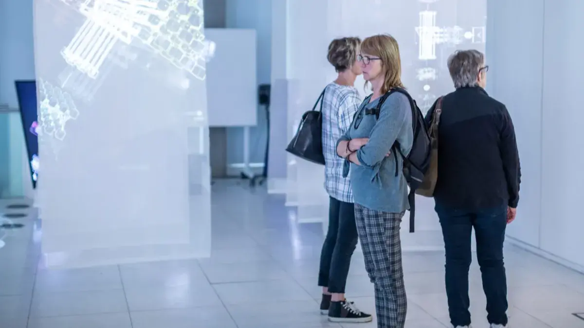 Visitors explore a digital exhibition at the University's Inspace gallery. 