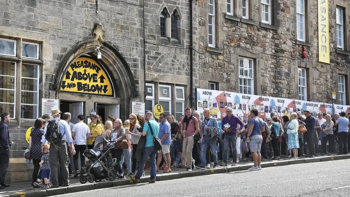 People queue for a festival show