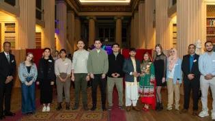 A group of postgraduate students from the first cohort of the Education Beyond Borders scheme gathered in the Playfair Library