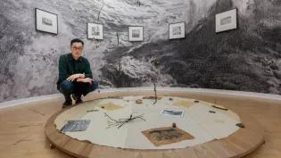 Artist Kang Seung Lee pictured with his installation at Talbot Rice Gallery
