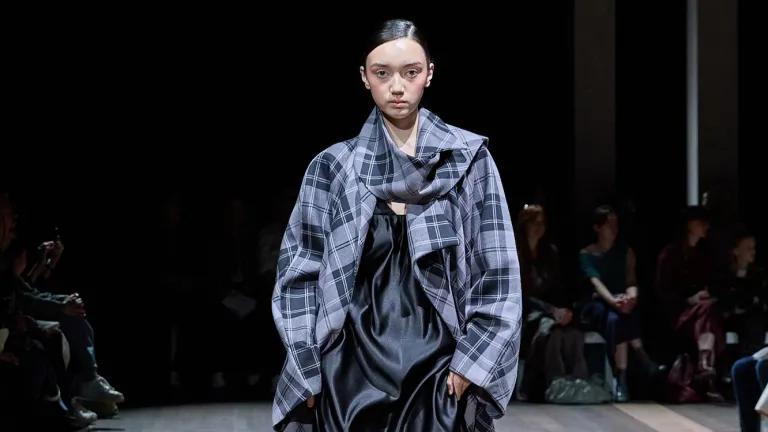 A model walks down the catwalk showcasing an ECA students design