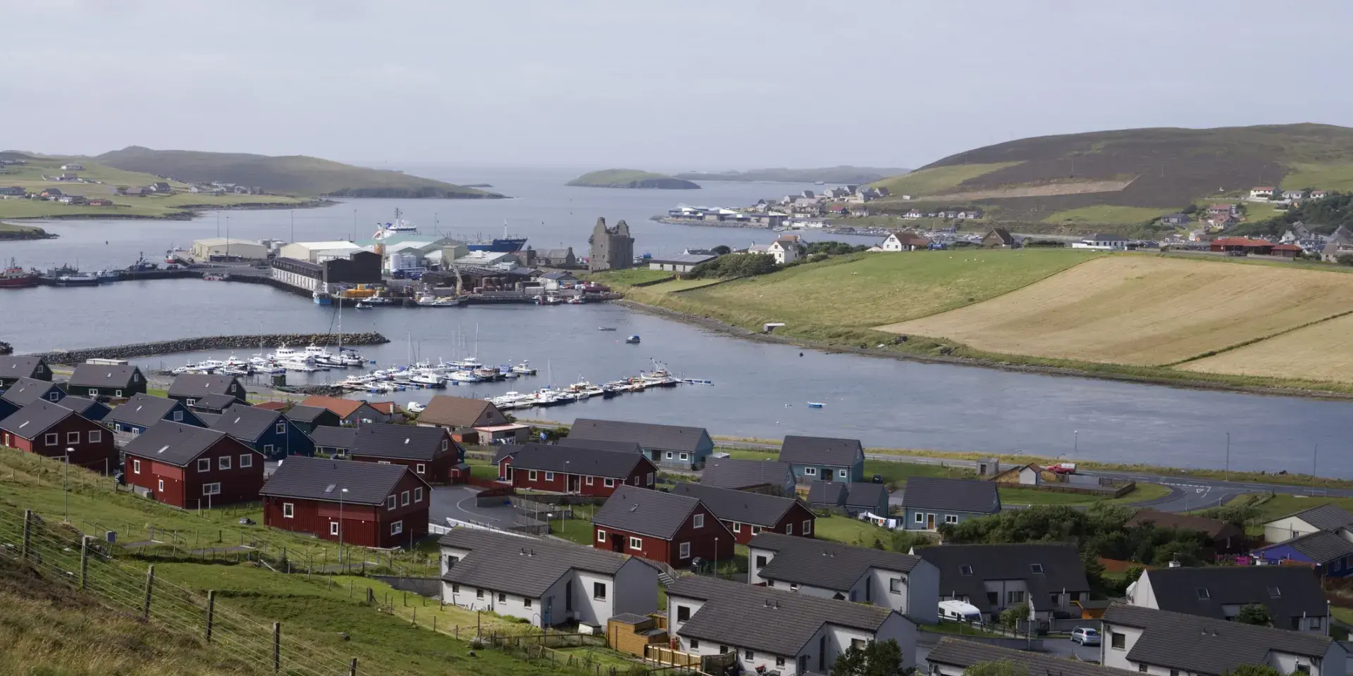 A cluster of houses next to water in Scalloway, Shetland Islands