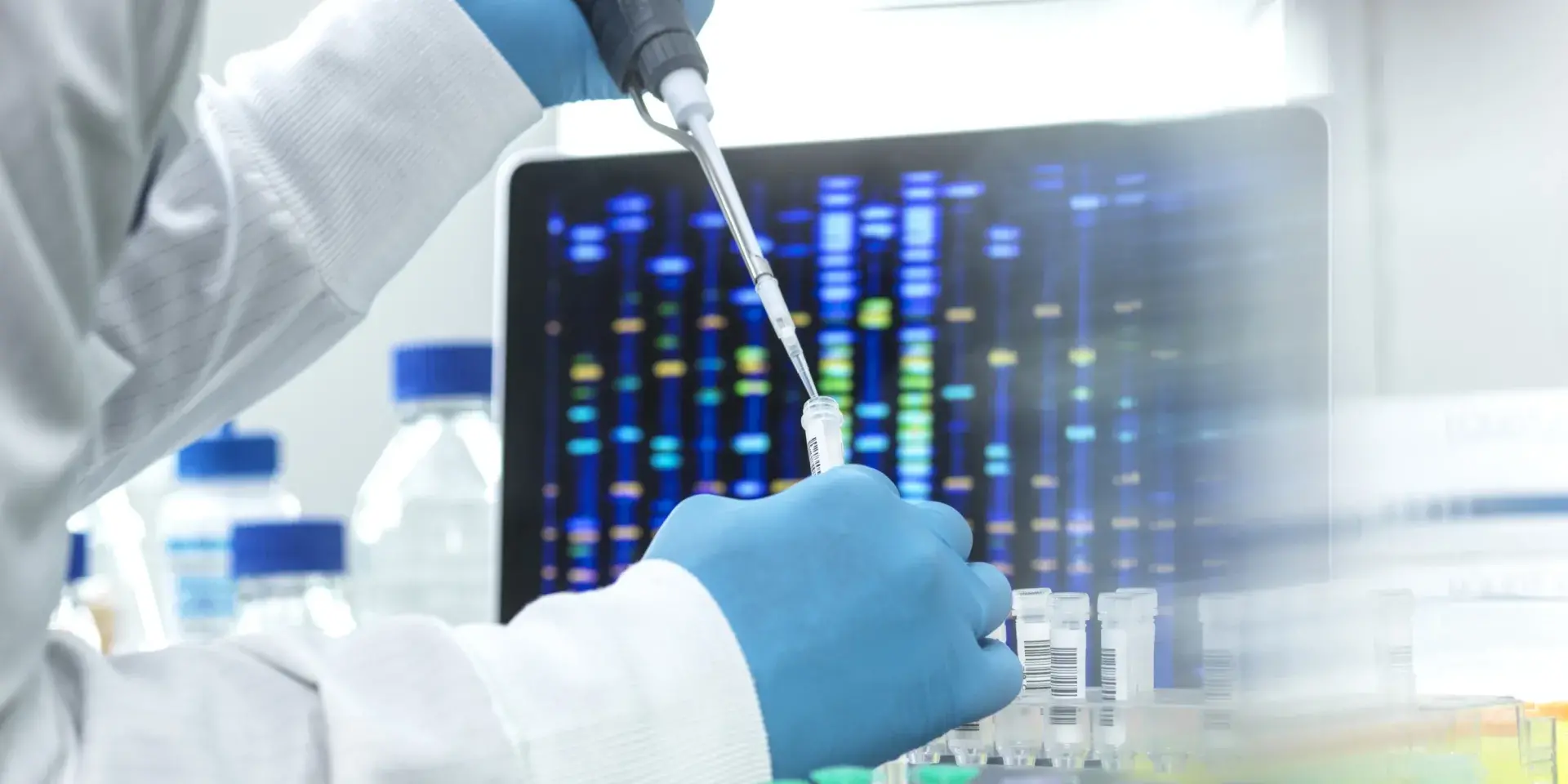 Scientist pipetting sample into a vial for DNA testing