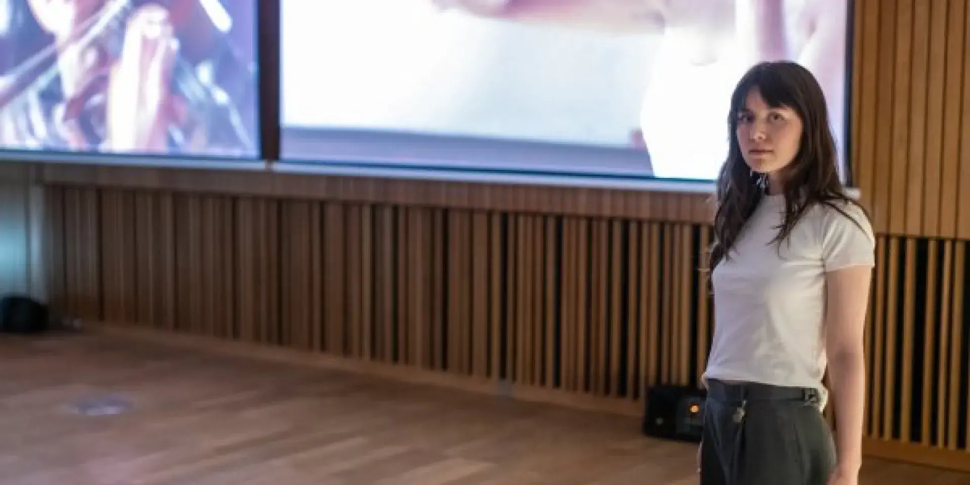 Artists in from of filmed classical performances