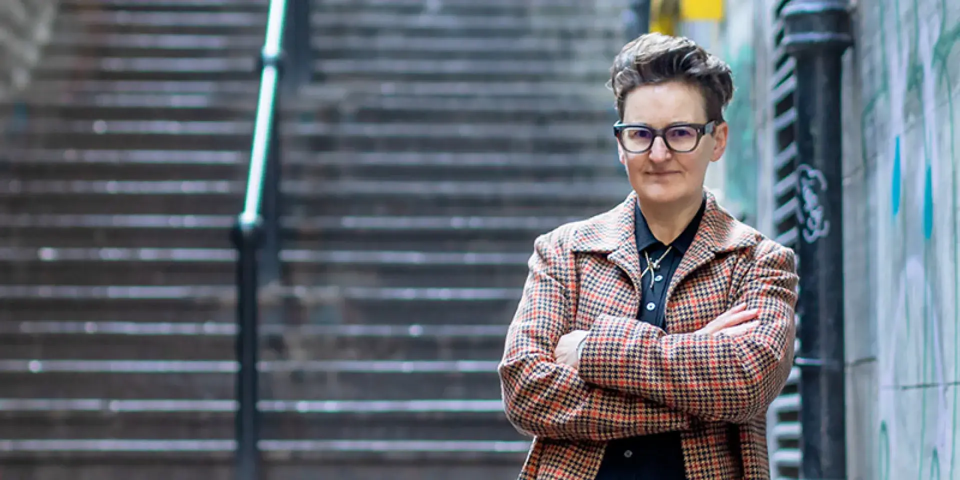 Author next to a stone step