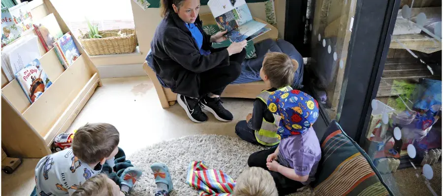 Staff member plays with children at Easter Bush Nursery
