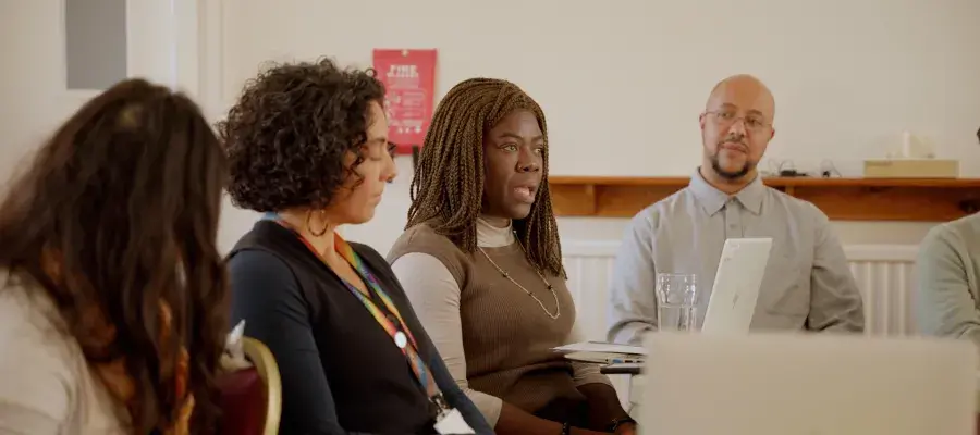 Four members of the University community sit in an engagement session as part of the Race Review