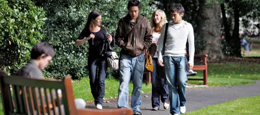 Students taking a walk in George Square gardens, Central Area campus.