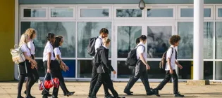 Group of school pupils in school uniform