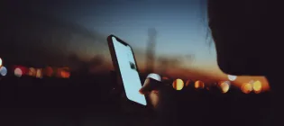 Abstract of a young person using a phone