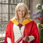 Dr Christine Middlemiss receiving their honorary degree.