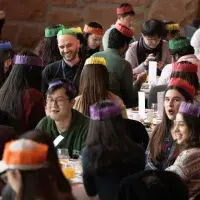 Staff and students sit together at 2024 Festive Lunches