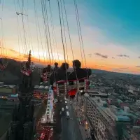 An elevated look at the city centre taken from a swing ride, high above Edinburgh's Princes Street