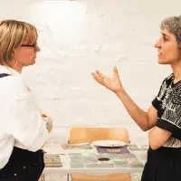 Colleagues talking at the Impact Festival