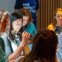 Colleagues during a session at The Impact Fesitval