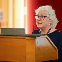 Tina Harrison speaking at the PGT dissertation celebration event