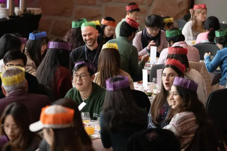 Staff and students sit together at 2024 Festive Lunches