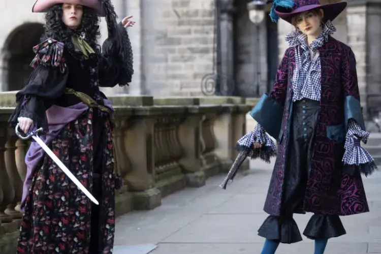 Two students pose in Their Performance Costume 2025 outfits for a photocall in Old College Quad. (L-R) Jean-Benoit Aubery from Daphne Du Maurier’s 1941 romantic adventure novel, Frenchman’s Creek and Barbara, the heroine of historical novel, Life and Death of the Wicked Lady Skelton 