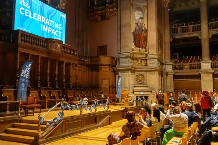 Colleagues looking towards the stage in McEwan Hall