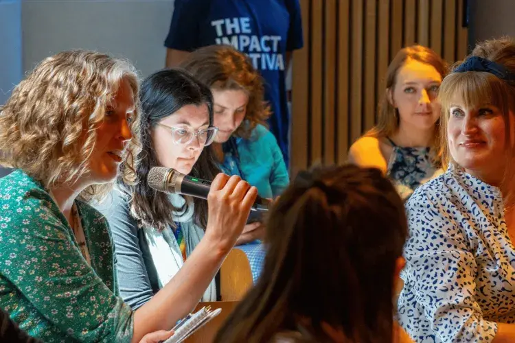 Colleagues during a session at The Impact Fesitval