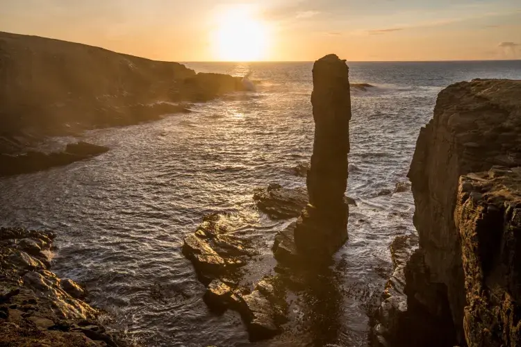 Winter sunset at Yesnaby sea stack Orkney.