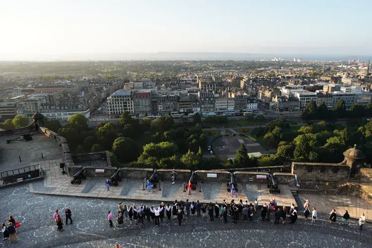 A view of the procession through the castle with the city in the background
