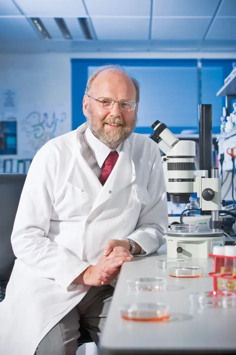 Professor Sir Ian Wilmut in lab coat portrait