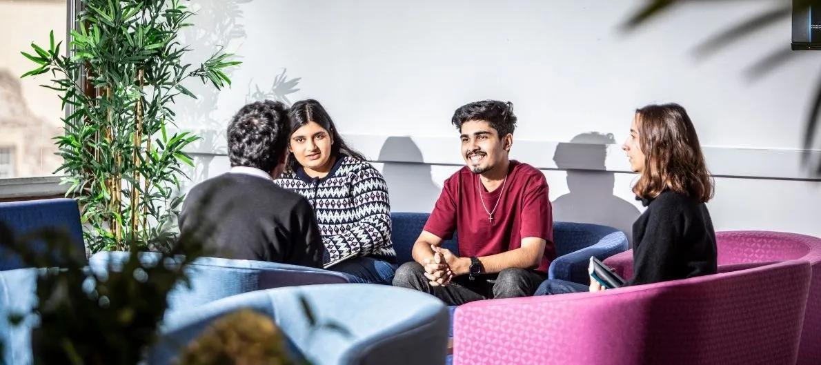 Postgraduate students chatting on campus