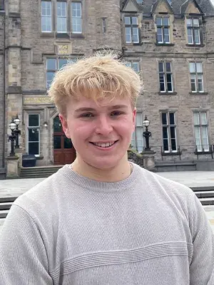 Bryce standing in front of Edinburgh Futures Institute